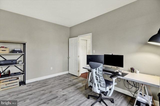 office area with wood finished floors and baseboards