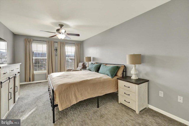 bedroom with ceiling fan, carpet floors, and baseboards