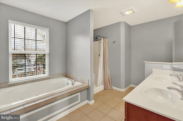 full bath with double vanity, a bath, a sink, and tile patterned floors