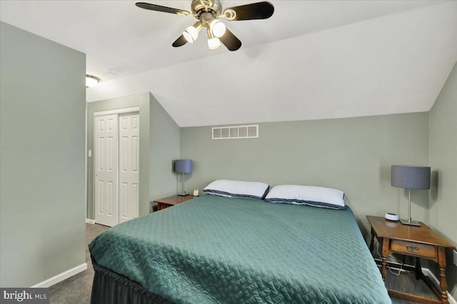 bedroom with visible vents, baseboards, vaulted ceiling, a ceiling fan, and dark carpet