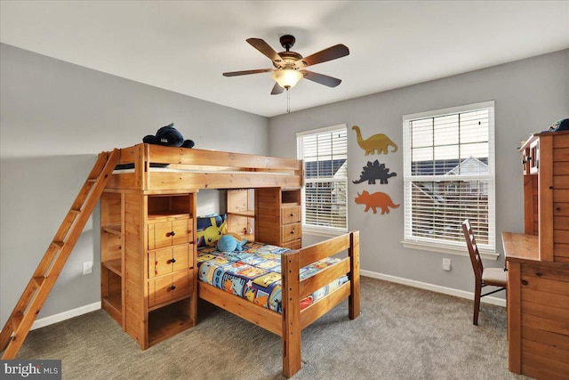 bedroom with carpet flooring, a ceiling fan, and baseboards