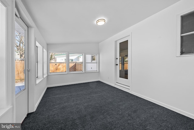 unfurnished sunroom featuring lofted ceiling