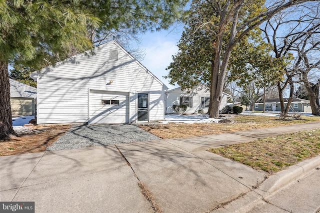 view of front of property featuring driveway and a garage