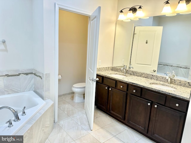 full bathroom with a bath, a sink, toilet, and double vanity