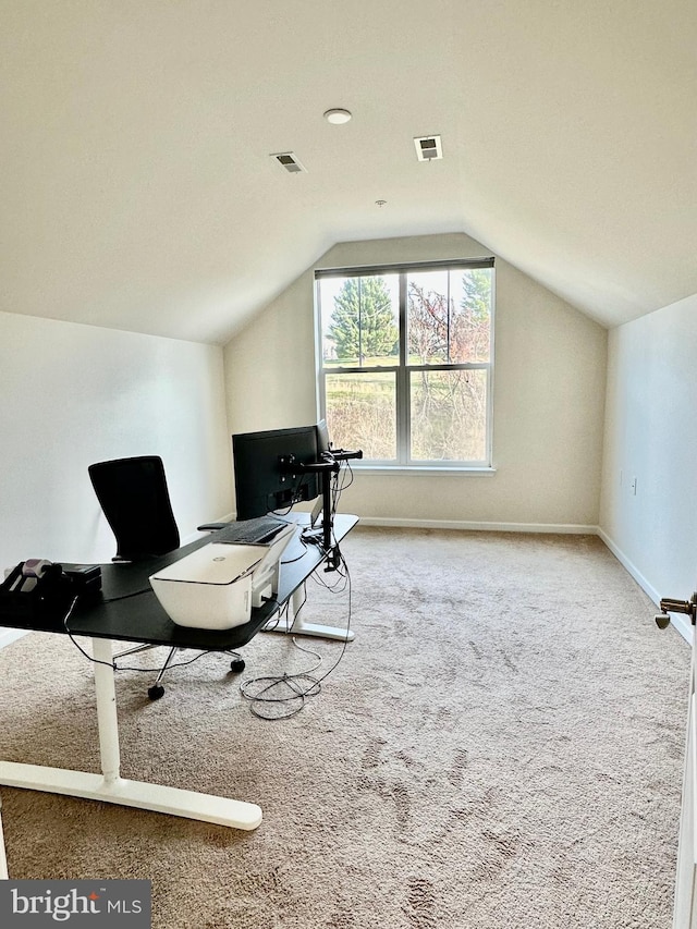 office area with lofted ceiling, carpet, visible vents, and baseboards