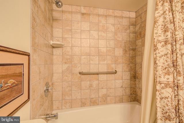 bathroom with shower / bathtub combination with curtain