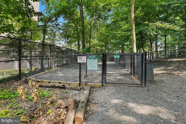 view of gate featuring fence