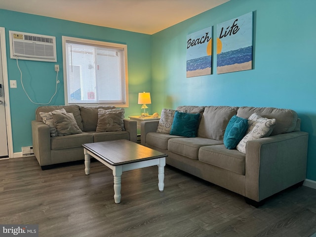 living room featuring dark wood-style floors, a baseboard radiator, a wall unit AC, and baseboards