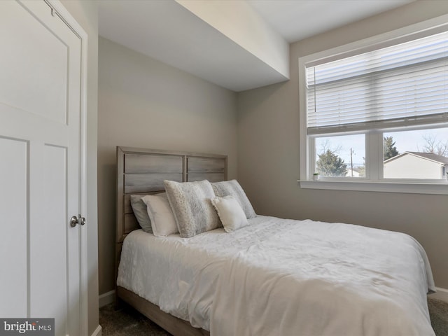 bedroom featuring baseboards