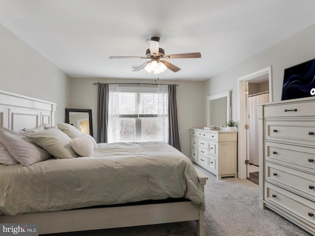 bedroom featuring a ceiling fan and light carpet