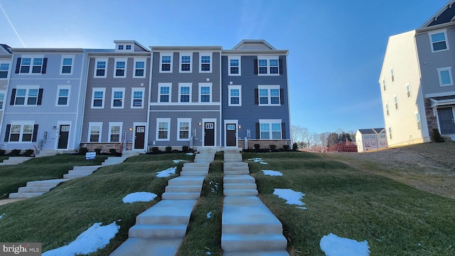 view of property featuring a front yard