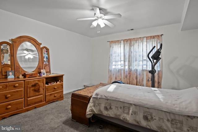 carpeted bedroom featuring ceiling fan and visible vents