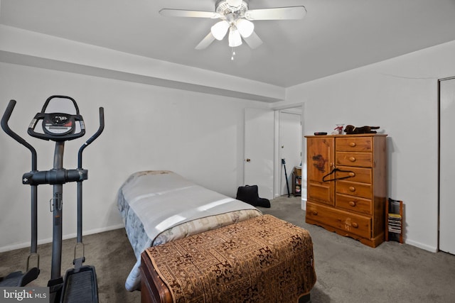 carpeted bedroom with a ceiling fan and baseboards