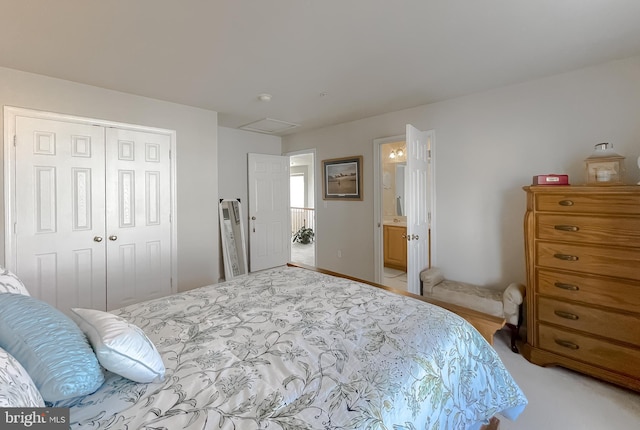 bedroom featuring a closet and ensuite bath