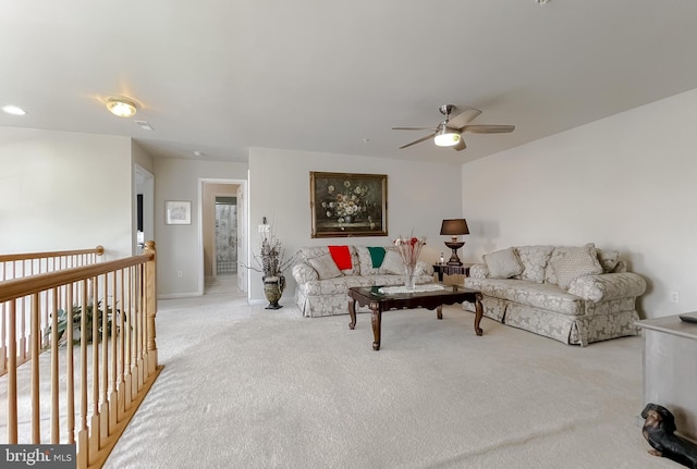 living room featuring light carpet and ceiling fan