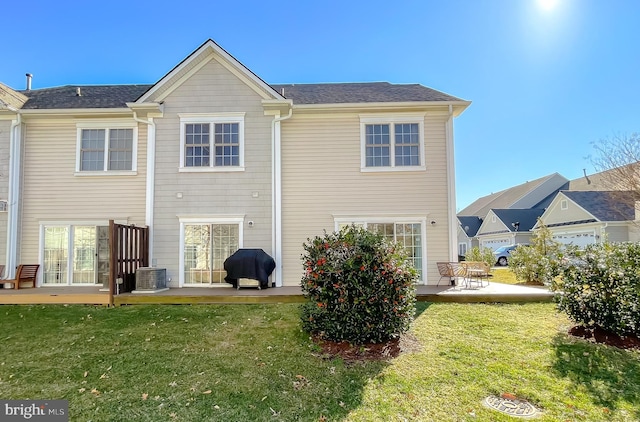 back of house with a patio and a yard