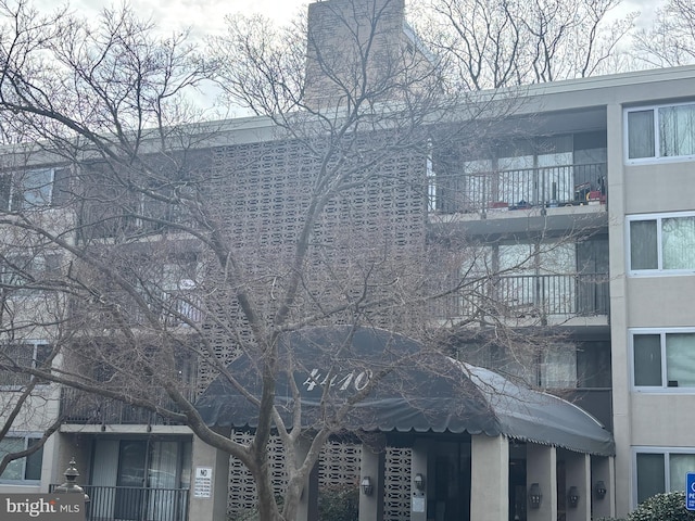 view of side of home with stucco siding