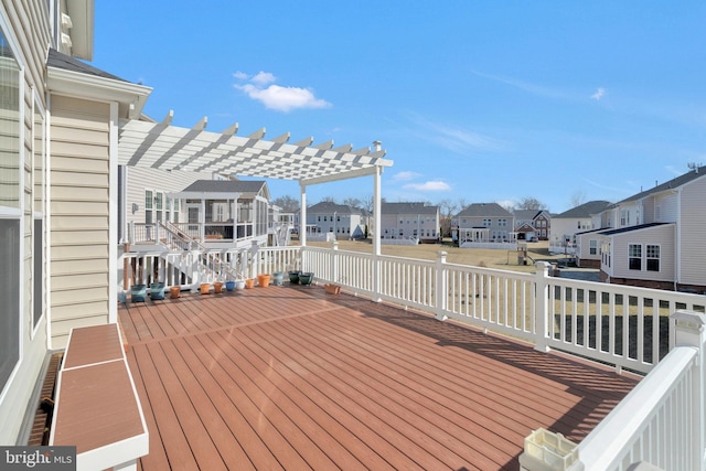 deck with a residential view and a pergola