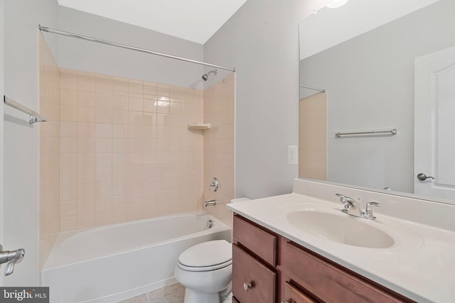 bathroom with shower / bath combination, vanity, toilet, and tile patterned floors