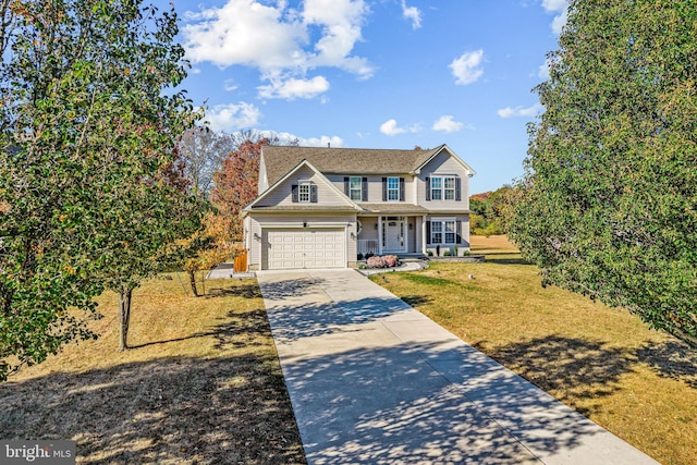 traditional-style home featuring covered porch, concrete driveway, and a front lawn