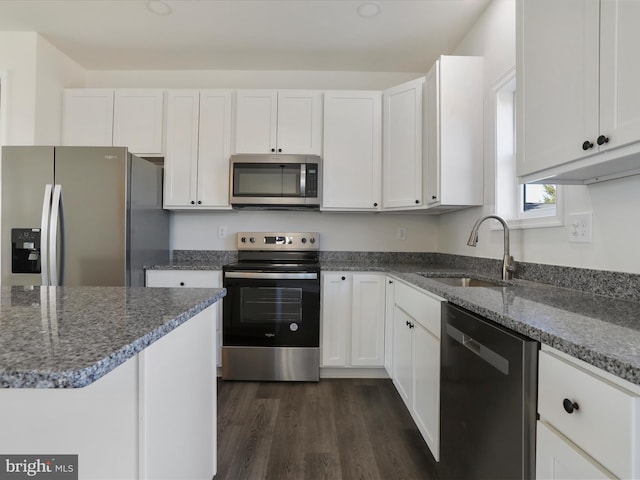 kitchen featuring white cabinetry, appliances with stainless steel finishes, and a sink