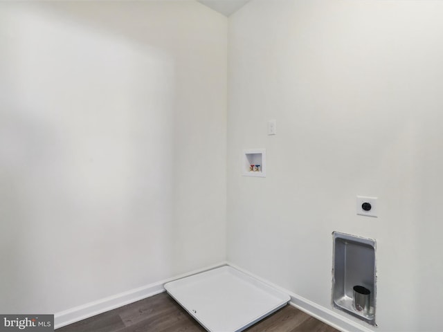 laundry area featuring electric dryer hookup, dark wood-type flooring, baseboards, hookup for a washing machine, and laundry area