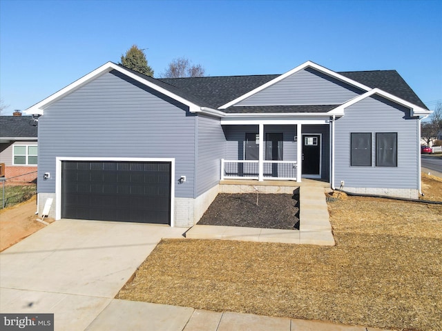 ranch-style home featuring a porch, concrete driveway, an attached garage, and a shingled roof