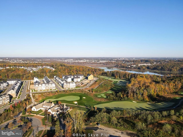 birds eye view of property featuring view of golf course and a water view