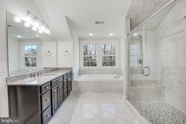 full bathroom featuring visible vents, a garden tub, a shower stall, and vanity