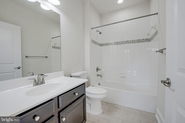 bathroom with tile patterned flooring, vanity, toilet, and shower / bathtub combination