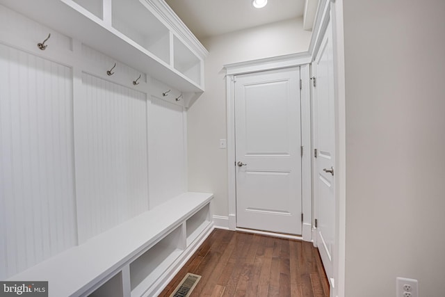 mudroom with visible vents and dark wood finished floors