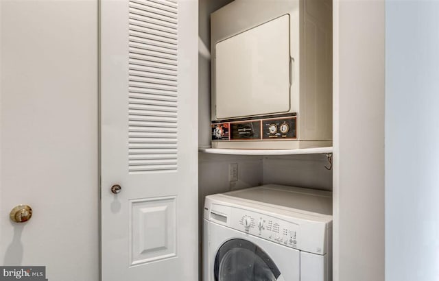 washroom with laundry area and stacked washer and dryer