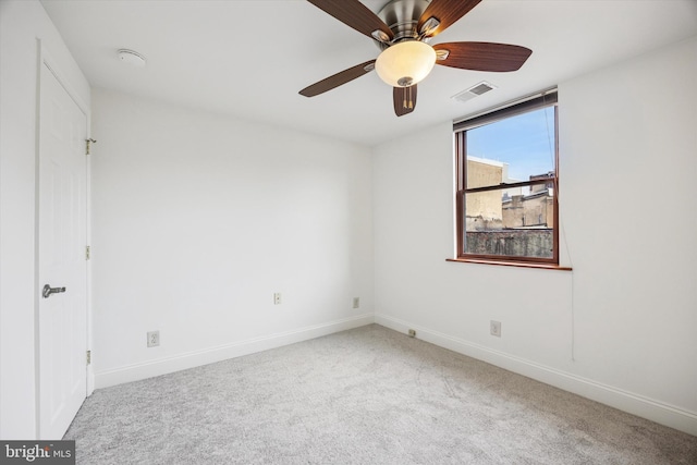 unfurnished bedroom featuring a ceiling fan, carpet, visible vents, and baseboards