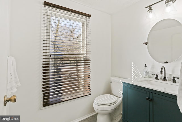 half bathroom with toilet, a textured ceiling, and vanity