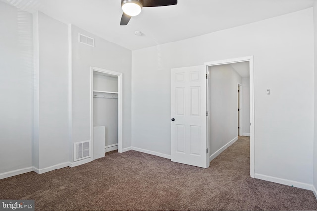 unfurnished bedroom featuring carpet, a closet, visible vents, and baseboards