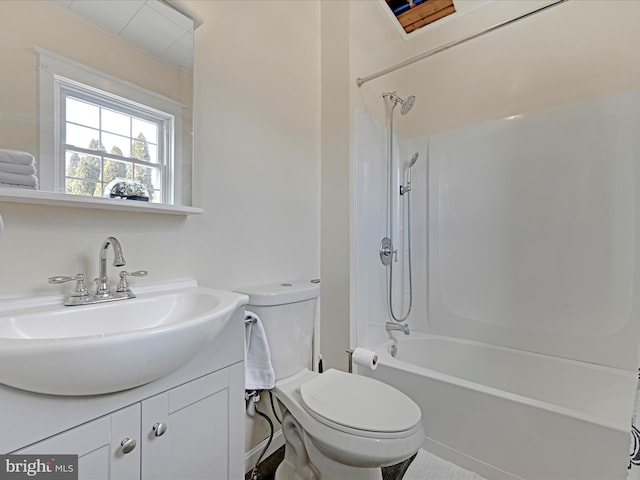 full bathroom featuring toilet, bathing tub / shower combination, and vanity