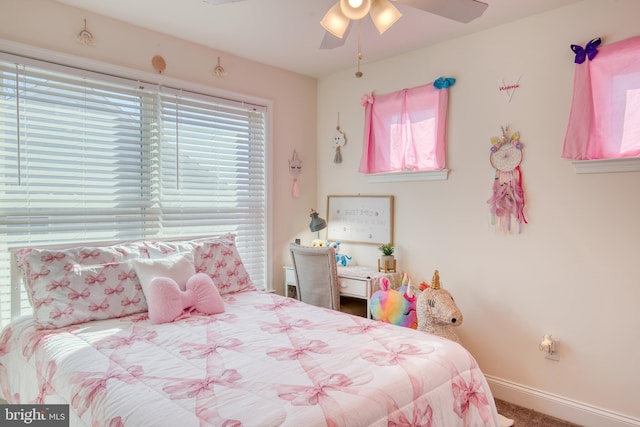 bedroom featuring carpet, baseboards, and a ceiling fan