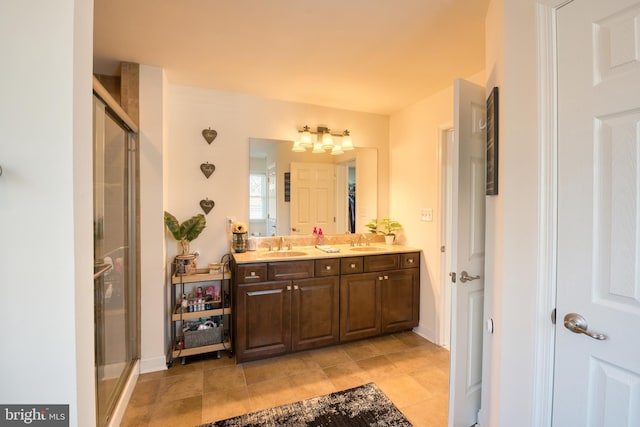 full bath featuring a stall shower, a sink, and double vanity