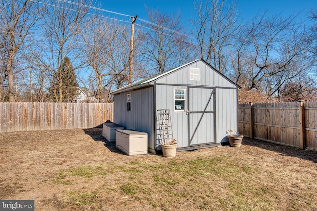 view of shed with a fenced backyard