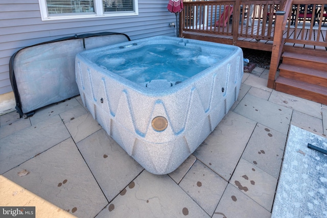 exterior details featuring a hot tub