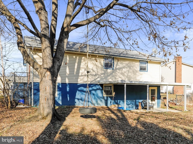 rear view of property featuring a patio area