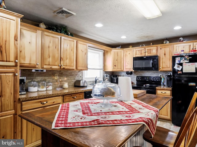 kitchen with tasteful backsplash, visible vents, dark stone counters, a textured ceiling, and black appliances