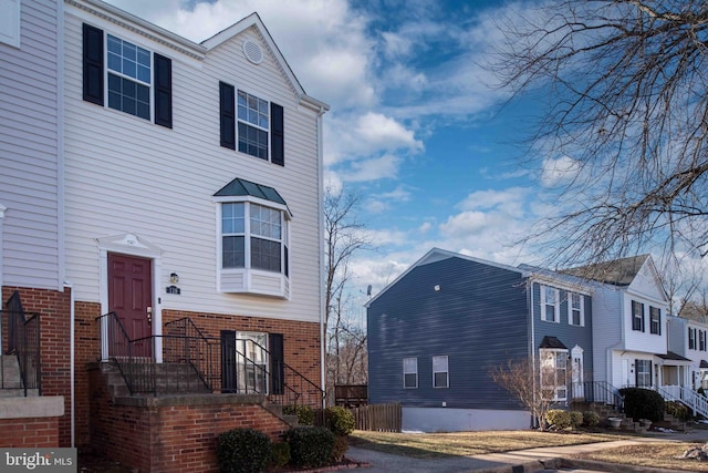 view of front of house with brick siding