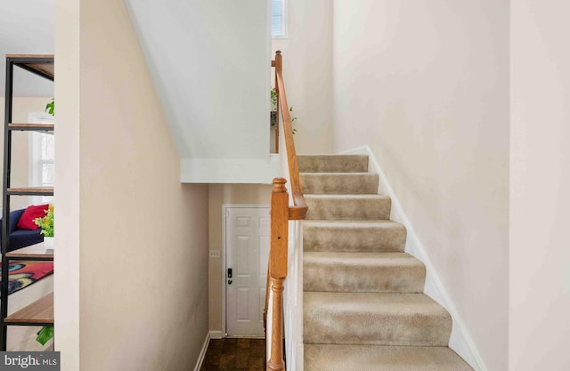 staircase with baseboards