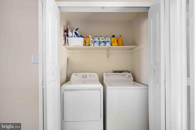 laundry room featuring laundry area and washer and clothes dryer