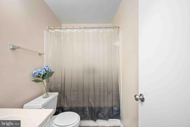 full bathroom with vanity and toilet