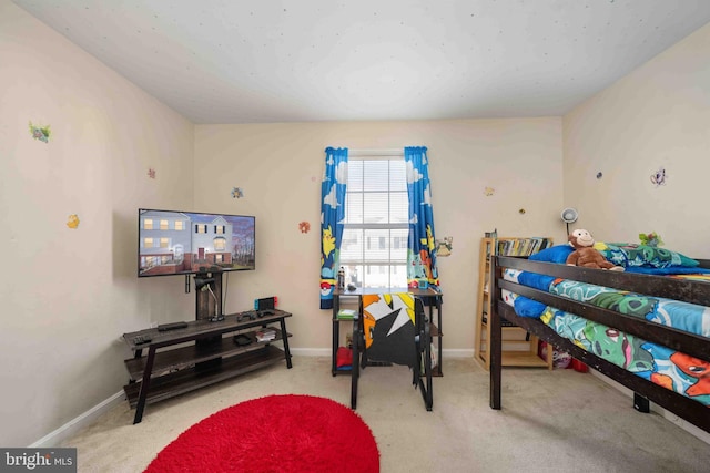 carpeted bedroom with baseboards