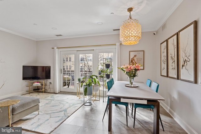 dining space with a chandelier, visible vents, crown molding, and baseboards