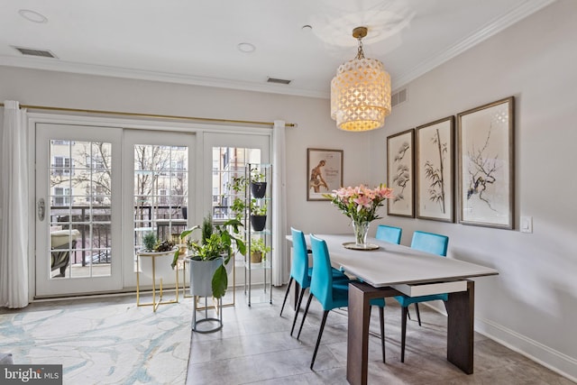 dining room featuring baseboards, a notable chandelier, visible vents, and crown molding