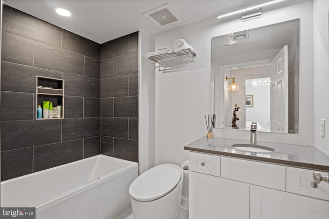 bathroom featuring toilet, shower / washtub combination, vanity, and visible vents